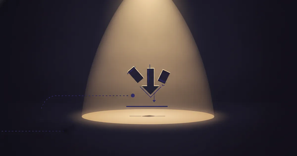 geometric forms in a warm spotlight pool on a dark stage