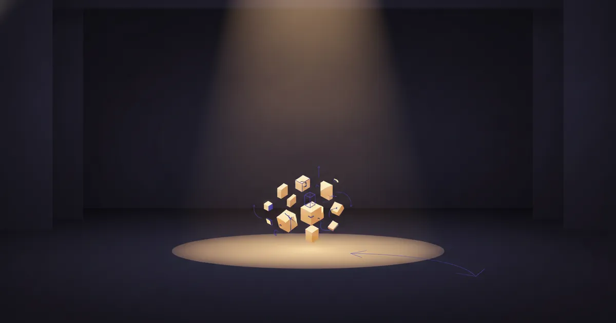 geometric forms in a warm spotlight pool on a dark stage